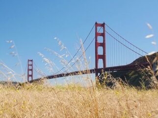 Historic Golden Gate Bridge with scenic natural surroundings. {{brizy_dc_image_alt imageSrc=